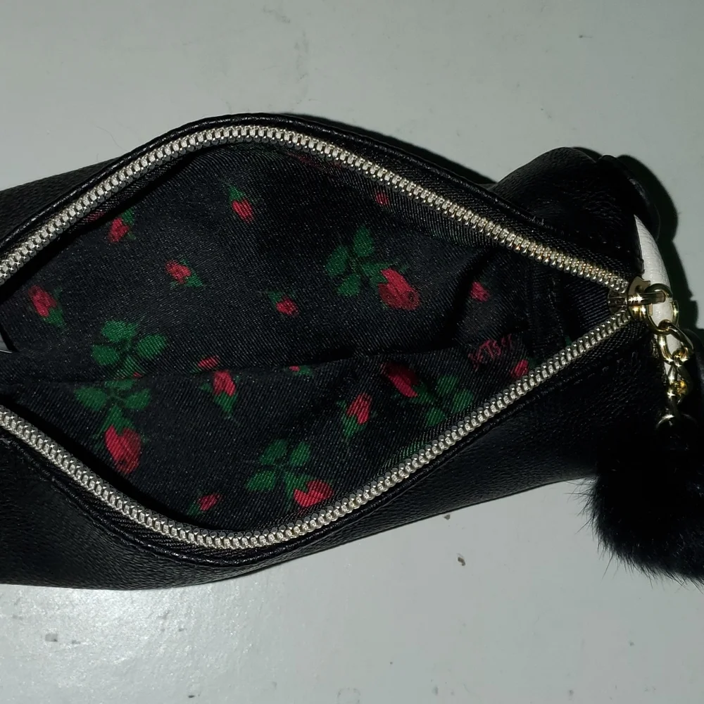 Betsey Johnson fux leatherpanda makeup case with pompom tail zipper